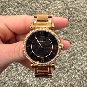 Rose gold, Michael Kors watch with a black face